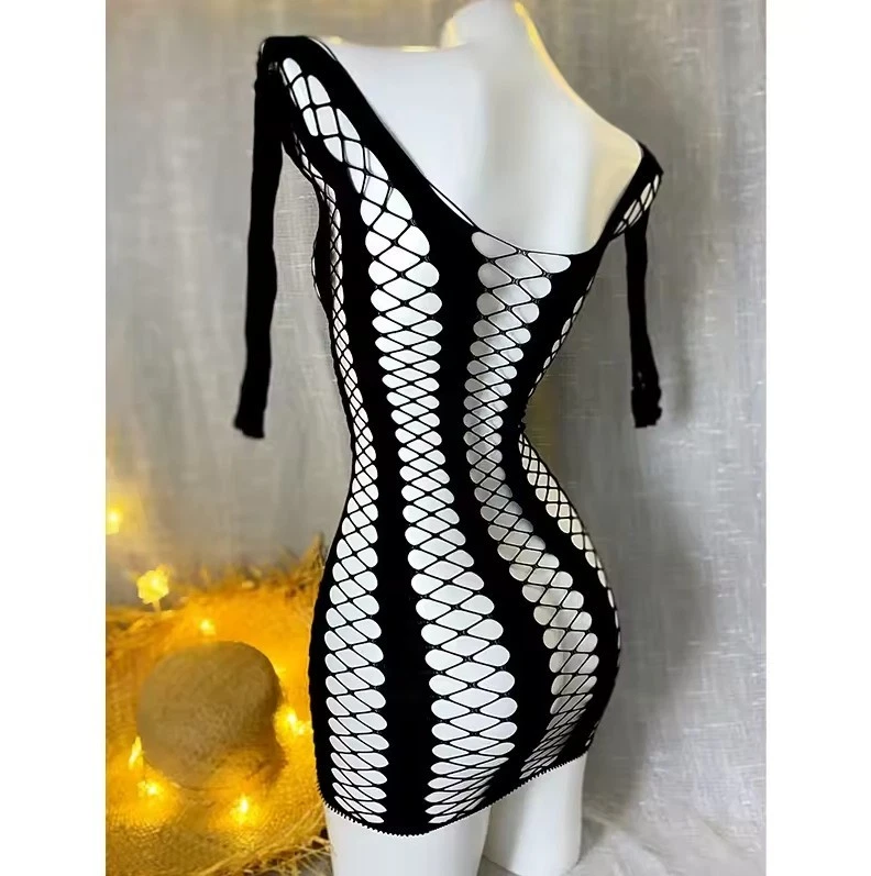 Criss Cross Pattern Swimsuit Cover New sheer top with crisscross strapping between solid panels. Very stretchy to fit many body styles.